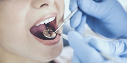 Closeup of patient receiving a dental checkup
