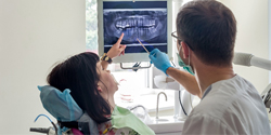 Dentist explaining how dental implants work