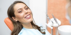 Patient smiling during dental checkup and teeth cleaning visit