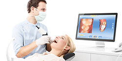 dentist using cerec one visit dental restoration system