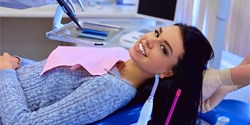 Female patient smiling after receiving dental implants in Edmond
