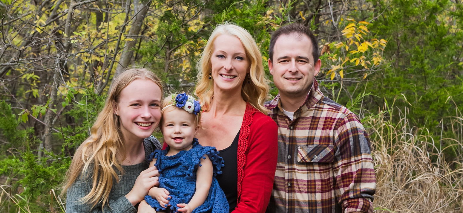 Edmond Oklahoma dentist Doctor Patrick Crowley with his family outdoors