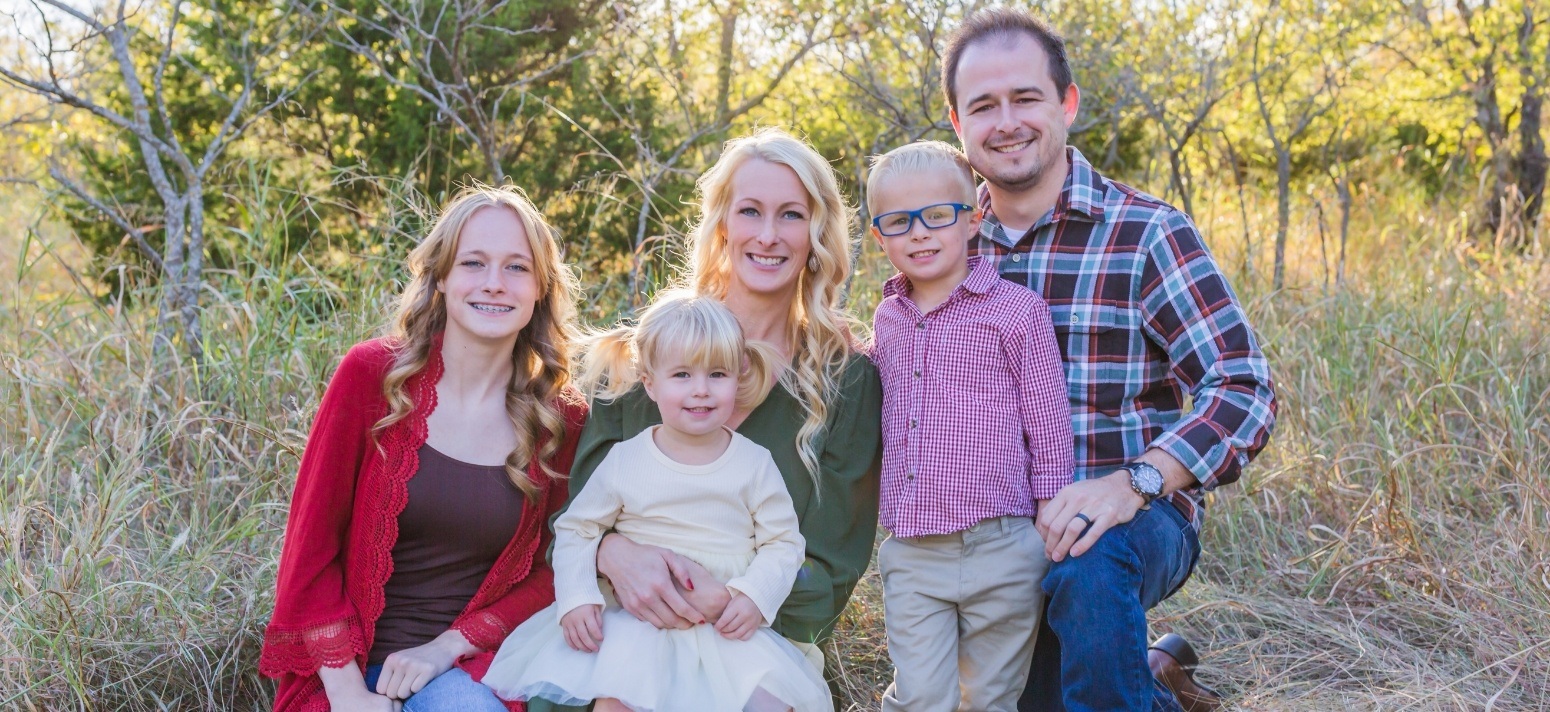 Edmond Oklahoma dentist Doctor Patrick Crowley with his family outdoors