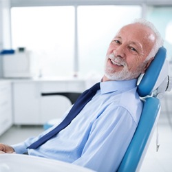 Man smiing during dental checkup and teeth cleaning visit