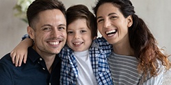 Smiling family showing off healthy smiles
