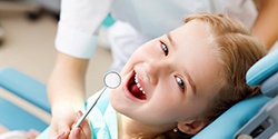 Happy child at dentist for family dentistry