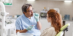 woman talking to her dentist during family dentistry visit