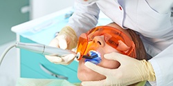 A woman undergoing a tooth-colored fillings treatment