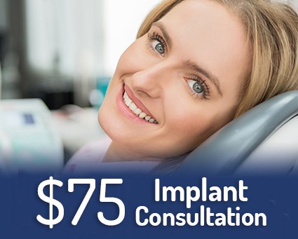 Smiling woman in dental chair with text that reads free implant consultation