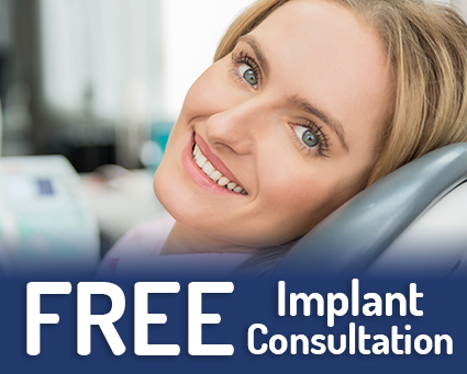 Smiling woman in dental chair with text that reads free implant consultation
