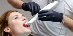 Dental implant dentist performing a digital impression scan