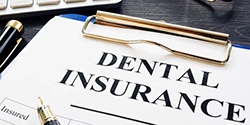 dental insurance paperwork on a clipboard