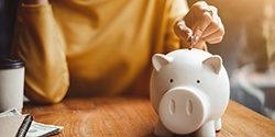 piggy bank representing cost of Invisalign in Edmond