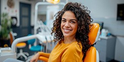 Happy dental patient in treatment chair