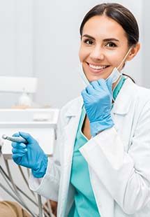 Dentist smiling during dental exam