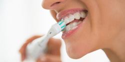 Woman brushing her teeth