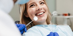 Lady smiles at dentist