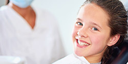 Young child smiling during children's dentistry visit