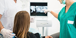 dentist showing x-ray