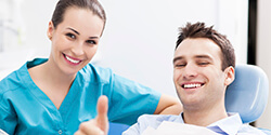 man giving thumbs up after tooth extractions