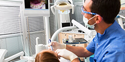 dentist using intraoral camera