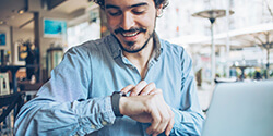 man checking watch for time