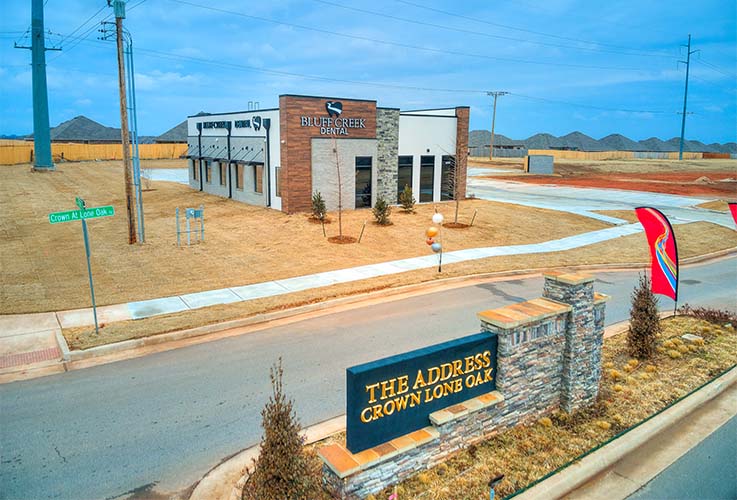 Outside of Edmond dental office and dental office roadside sign