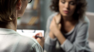 woman receiving mental health counseling