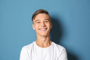 A teenage boy smiling.