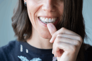 a patient wearing an Invisalign aligner